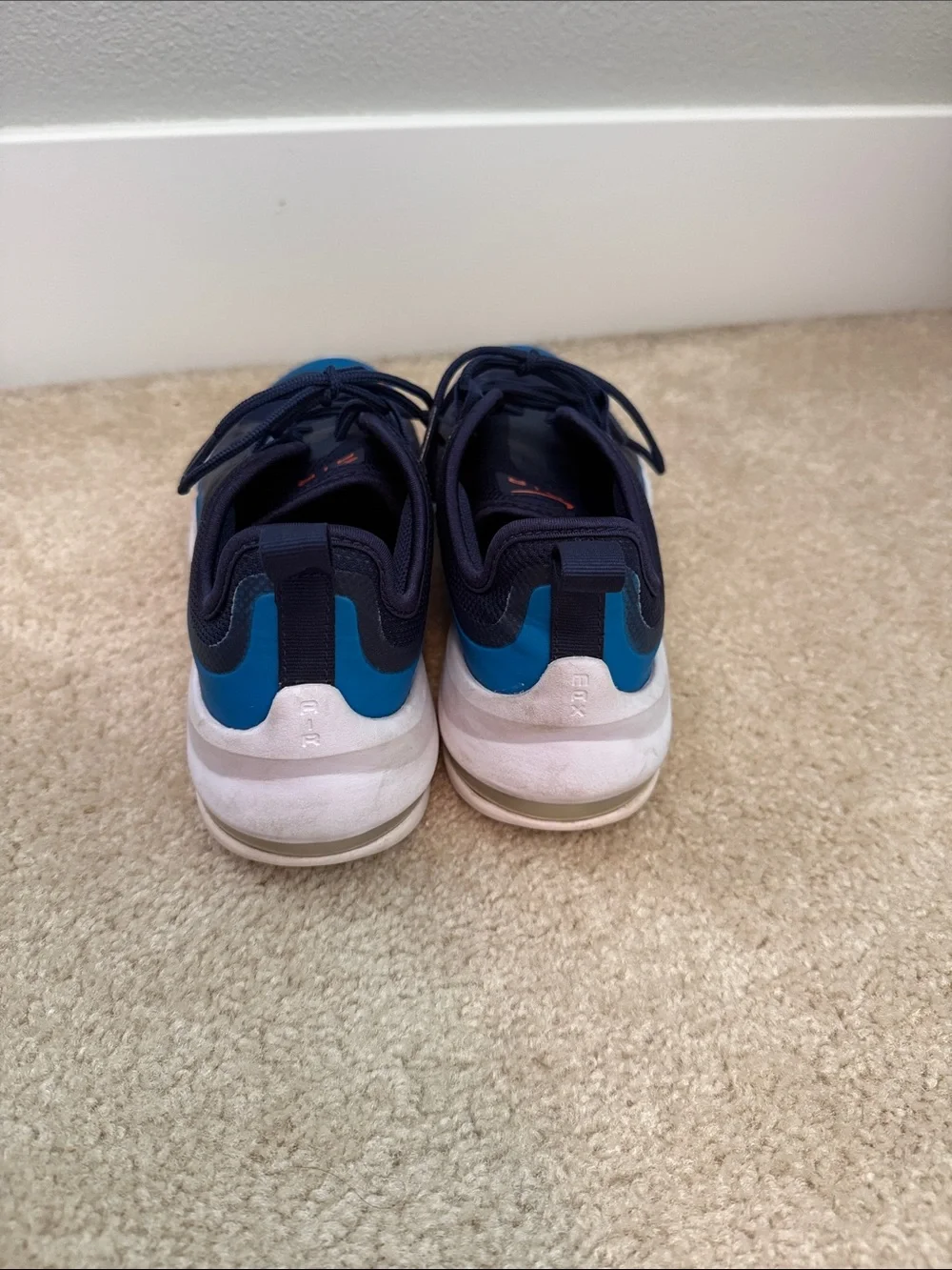 Boys size 4.5 Nike air Navy and Blue Sneakers with Orange Swoosh
